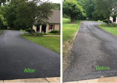 Side-by-side comparison of a driveway before and after being freshly paved, surrounded by grass and trees.